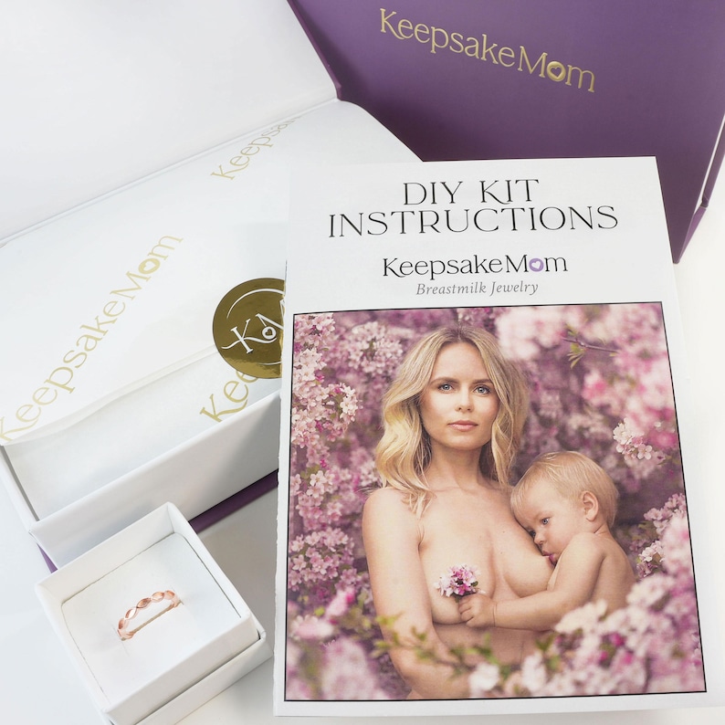 breastmilk jewelry DIY kit box with instructions, and ring made in a ring box outside of the purple diy kit box for breastmilk jewelry keepsakes from KeepsakeMom