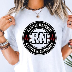 Funny Nurse Shirts for Work | Ratcheted RN Graphic Tee | Sassy Nightingale Nurse Shirt | Dark Humor Registered Nurse Comfort Colors T‑Shirt