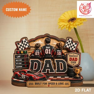 May include: A wooden racing-themed Father's Day gift. The centerpiece reads "DAD" with a race car, checkered flags, and a trophy. The text "FASTEST DAD EVER" is also visible. The gift is personalized with names and numbers.