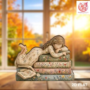 May include: A wooden figurine of a girl lying on a stack of books, with floral designs on the books and her dress. The figurine is painted in soft, muted colors, with a serene expression. The background shows a window with autumn foliage.
