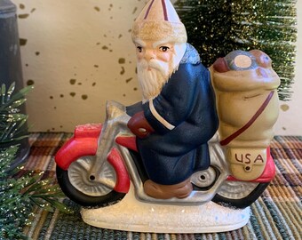 Folk Art Chalkware Belsnickle Santa from Chocolate Mold On Motorcycle