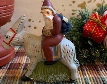 Folk Art Chalkware Belsnickle Santa from Chocolate Mold On Donkey Red Coat