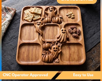 Könnte beinhalten: Ein quadratisches Serviertablett aus Holz mit neun unterteilten Fächern, das mit geschnitzten Geister- und Kürbismotiven verziert ist. Das Tablett enthält quadratische Cracker, Kürbiskerne und Nüsse. Der Text CNC ROUTER FILE ist oben zu sehen.
