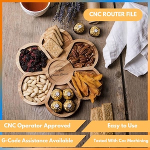 May include: A wooden serving platter with six sections, containing almonds, dried cranberries, biscuits, pecans, dried mango, and chocolate sweets. The tray is engraved with the text "Keti Balfour Dreams Blossom". The words "CNC ROUTER FILE" are also visible.