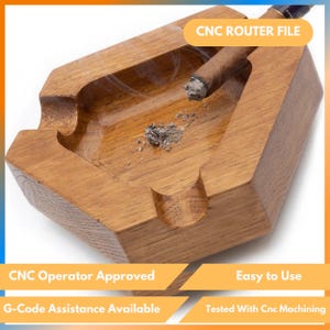 May include: A wooden ashtray with a cigar resting on the edge. The ashtray is a light brown color and has a rectangular shape with curved edges. The text "CNC ROUTER FILE" is visible. The ashtray is labeled "CNC Operator Approved" and "Easy to Use".