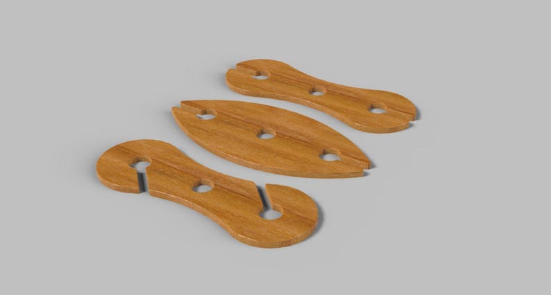 May include: Three wooden wine glass holders in a light brown color. The holders have a unique design with a slot for the glass stem and a hole for the glass base. The holders are arranged on a gray surface.