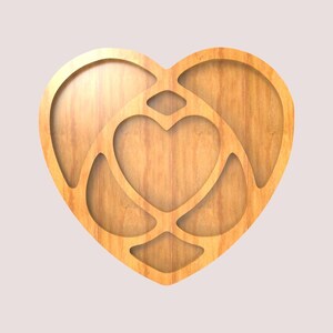 May include: A heart-shaped wooden decoration with a layered design. The outer heart frames an inner heart, with connecting lines creating a unique pattern. The wood has a warm, natural tone.