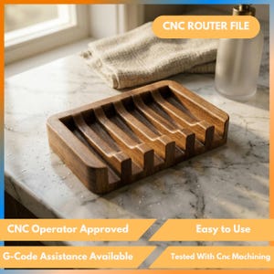 Puede incluir: Un jabonera rectangular de madera marrón oscuro con múltiples ranuras. La jabonera está sobre una encimera de mármol. El texto "CNC ROUTER FILE", "CNC Operator Approved", "Easy to Use", "G-Code Assistance Available" y "Tested With Cnc Machining" son visibles.