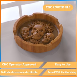 May include: A wooden ashtray with a carved skull design. The ashtray is round with a carved rim and features three skulls and decorative elements. The text "CNC ROUTER FILE" is visible in the image.
