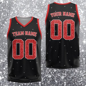 May include: Black athletic jersey with red trim and glittery red numbers and lettering. The front of the jersey reads "TEAM NAME" above the number "00". The back of the jersey reads "YOUR NAME" above the number "00".