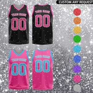 May include: A set of three ceramic mugs with a speckled, matte finish. The mugs are in shades of cream, light gray, and dark gray. Each mug has a simple, minimalist design and a rounded handle.