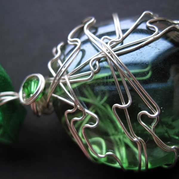 Earth God's Lyric. Legend of Zelda. Wind Waker. Farore. Farore's Pearl. Nintendo. Insipired. Wire Wrapped. Caged. Glass. Cabochon. Green. Ribbon. Necklace.