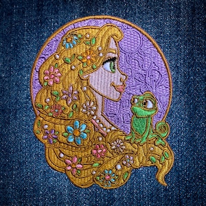 May include: A circular embroidered patch featuring a profile of a person with long, flowing golden hair adorned with blue, pink, and orange flowers. A small green chameleon sits on the hair against a purple background with a sun motif.