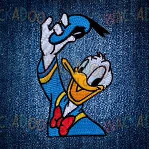 May include: Embroidered patch featuring Donald Duck in a classic pose. The patch showcases Donald in his signature blue sailor shirt, red bow tie, and yellow beak. The design is detailed with white, yellow, and black accents, set against a denim background.