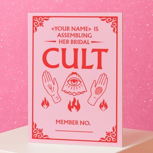 May include: A pink card with red text and illustrations. The text reads "<YOUR NAME> IS ASSEMBLING HER BRIDAL CULT" with illustrations of hands, an eye, and flames. The bottom of the card has a line for a member number.