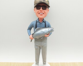 Figurka wędkarza z kiwającą głową: ręcznie malowana figurka wędkarza z żywicy