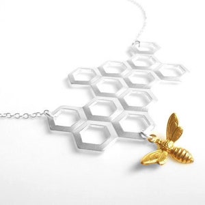 Honeycomb Necklace - gold brass bumblebee dangles from large bee hive pendant in matte silver on simple silver plated chain