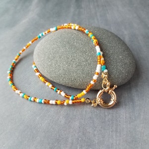 Seed Bead Necklace, oversized chunky front gold sailor clasp, orange turquoise blue seed beads, tiny little bead strand, seed bead strand