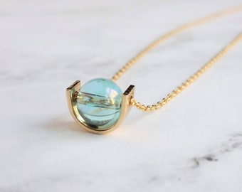 Modern Gold Necklace, blue glass pendant, spinner necklace, orb necklace, gold half circle necklace, sky blue necklace, eclipse necklace