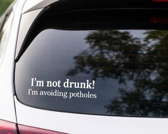 Funny Car Decal Sticker | Small Rear Window Vinyl | “I’m Not Drunk Im Avoiding Pot Holes” | Gift Idea | Bumper Sticker
