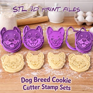 May include: Purple dog-shaped cookie cutters and stamped cookies are displayed on a wooden surface. The text "STL 3D PRINT FILES" and "Dog Breed Cookie Cutter Stamp Sets" are visible. The cookies are light brown.
