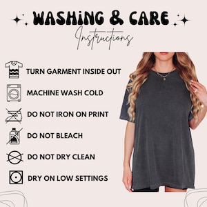 May include: A charcoal gray short-sleeved t-shirt with a crew neckline. To the left, text reads: WASHING & CARE INSTRUCTIONS, TURN GARMENT INSIDE OUT, MACHINE WASH COLD, DO NOT IRON ON PRINT, DO NOT BLEACH, DO NOT DRY CLEAN, DRY ON LOW SETTINGS.