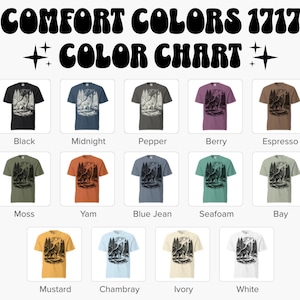 Puede incluir: Una carta de colores Comfort Colors 1717 con catorce camisetas de varios colores, cada una con un gr&aacute;fico en blanco y negro de un lobo aullando a la luna en un bosque. Los colores incluyen negro, medianoche, pimienta, baya, espresso, musgo, &ntilde;ame, azul jean, espuma de mar, bah&iacute;a, mostaza, chambray, marfil y blanco.