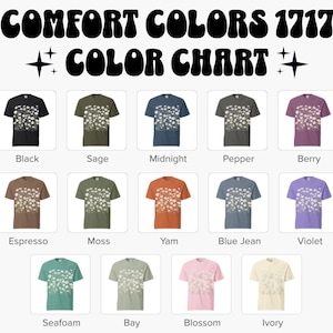 May include: Color chart featuring Comfort Colors 1717 t-shirts in various colors. The image displays a range of t-shirt colors, including black, sage, midnight, pepper, berry, espresso, moss, yam, blue jean, violet, seafoam, bay, blossom, and ivory. Each shirt has a floral design.