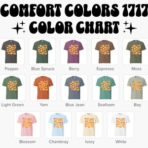 May include: A colour chart presents Comfort Colors 1717 t-shirts in various shades. Each shirt displays a unique colour, such as Pepper, Blue Spruce, Berry, Espresso, Moss, Light Green, Yam, Blue Jean, Seafoam, Bay, Blossom, Chambray, Ivory, and White. The shirts have a graphic.