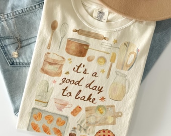 Camiseta «Es un buen día para hornear» - Colores cómodos, Camiseta de repostería, Regalo para chef pastelero, Camiseta de repostería estilo cottagecore, Regalos de repostería, Camiseta de masa madre, Camiseta de galletas