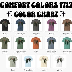 May include: A Comfort Colors 1717 color chart featuring fourteen short-sleeve t-shirts in various colors, each displaying a graphic of hanging green leaves with an orange flower. The colors include black, midnight, pepper, berry, espresso, moss, light green, yam, blue jean, seafoam, bay, chambray, ivory, and white.