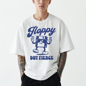 Floppy But Fierce Unisex T-Shirt | Retro Tech Nostalgia | Gildan 5000 | Vintage Floppy Disk Graphic Tee | Geeky Computer Humor Gift