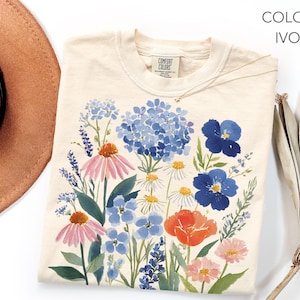 Puede incluir: Un juego de tres tazas de cerámica con un acabado mate moteado. Las tazas son de color crema, marrón claro y marrón oscuro. Cada taza tiene un diseño simple y minimalista.