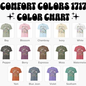 May include: A color chart featuring t-shirts in various colors, including Bay, Blossom, Chambray, Ivory, and White. The text "COMFORT COLORS 1717 COLOR CHART" is displayed at the top. Additional colors include Pepper, Berry, Espresso, Moss, Watermelon, Yam, Blue Jean, Violet, and Seafoam.