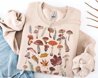 Sudadera vintage con estampado de setas, jersey de cuello redondo con motivos botánicos otoñales, jersey con estética cottagecore otoñal, jersey para amantes de la naturaleza forestcore, ambiente acogedor otoñal.