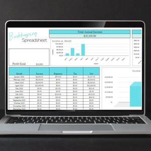 May include: A laptop screen displaying a bookkeeping spreadsheet with a blue and white color scheme. The spreadsheet shows monthly income, expenses, tax, and net income for the year 2023. A bar graph shows income versus month. The total annual income is $20,500.00.
