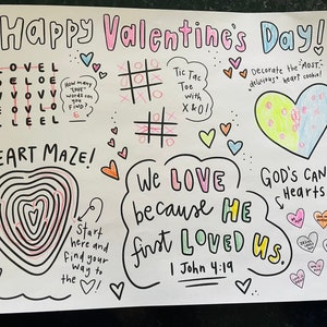 May include: A colorful Valentine's Day card with a heart maze, a tic-tac-toe game, and a message that says "We love because He first loved us. 1 John 4:19".