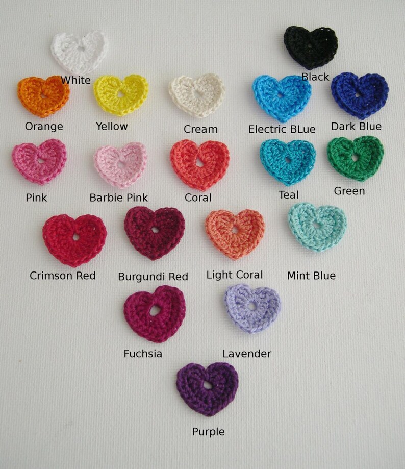 May include: A collection of crocheted heart appliques in various colors, including white, orange, yellow, cream, pink, coral, red, purple, and blue. Each heart is labeled with its color name, such as "Electric Blue" and "Crimson Red".