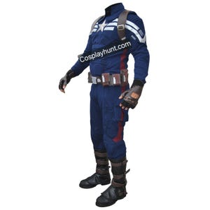 May include: A Captain America costume in navy blue with white accents, a star emblem, and a brown leather harness. The costume includes gloves, boots, and a utility belt. The text "Cosplayhunt.com" is visible on the chest.