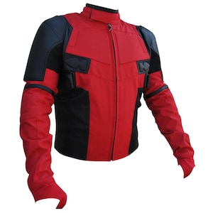 May include: A red and black jacket with a high collar and a front zipper. The jacket features black panels on the shoulders and sides, with additional black accents and details. The sleeves are long and red, and the jacket appears to be made of a durable material.