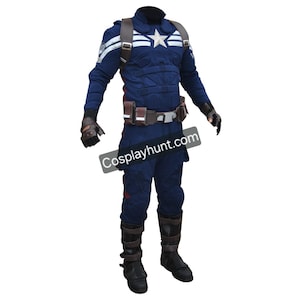 May include: A Captain America costume featuring a navy blue jumpsuit with white star and stripe details. The costume includes a brown belt, gloves, boots, and a harness. The text "Cosplayhunt.com" is visible on the lower right.