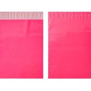 May include: Two rectangular hot pink poly mailers shown side by side. Each mailer features a smooth, opaque plastic surface and a wide, light-colored adhesive strip across the top edge for sealing the bag securely for shipping purposes.