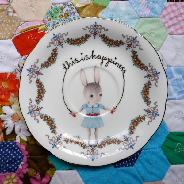 This is Happiness Skipping Bunny with Floral Swag Border Vintage Illustrated Plate