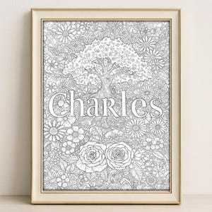 May include: A black and white line art print of a tree with the name "Charles" written underneath. The tree is surrounded by flowers and leaves.