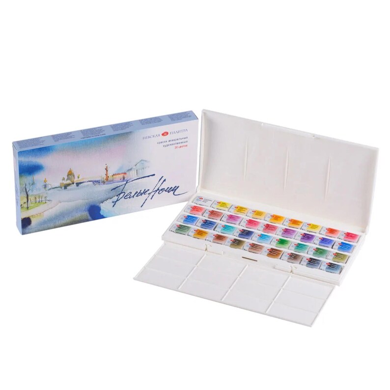 May include: A watercolor paint set in a white plastic case with a lid. The case contains an array of colorful paint pans. The box has a watercolor painting on the front and text in a foreign language.