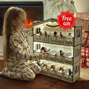 May include: A three-story wooden toy horse stable featuring individual stalls with arched openings, internal LED lighting, and small nameplates for each stall. The structure is designed with a gabled roof and houses multiple miniature toy horses.