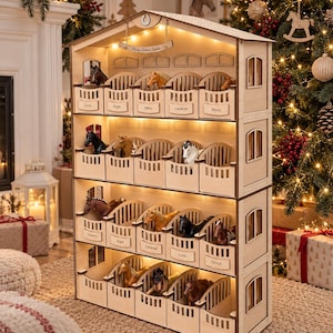 May include: A four-storey wooden horse stable toy with individual stalls, each featuring a nameplate and a small plastic horse figurine. The structure is illuminated by integrated warm LED lights and includes a horseshoe emblem at the top peak.
