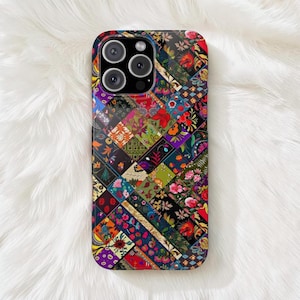 May include: A smartphone case featuring a vibrant, multi-colored patchwork design composed of various diagonal rectangular segments. Each segment displays distinct floral, geometric, and abstract patterns in shades of red, blue, green, and orange.
