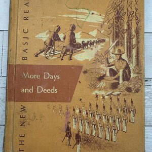 May include: Vintage book cover titled "More Days and Deeds" from "The New Basic Reader" series. The cover features illustrations of people working and soldiers marching, all in sepia tones. The book is a light brown color.