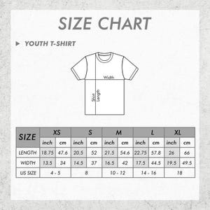 May include: A size chart for youth t-shirts, with measurements in inches and centimeters. The chart includes sizes XS to XL, detailing shirt length and width, and corresponding US sizes. The text "SIZE CHART" is at the top.